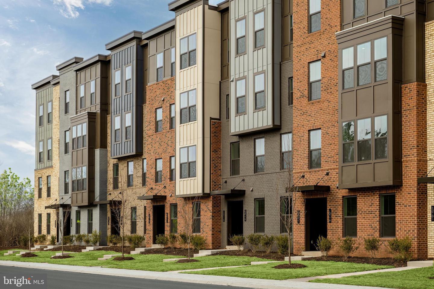 Row of newly built brick and siding townhomes in a Northern Virginia community